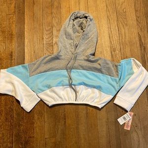 It’s a long sleeve hooded crop top! Very soft from the inside nice material